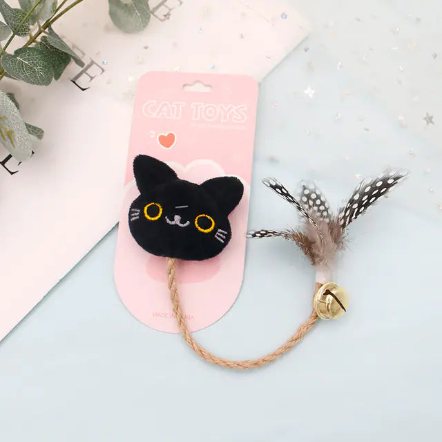 Juguete para gato con pluma, cascabel y muñeco😻